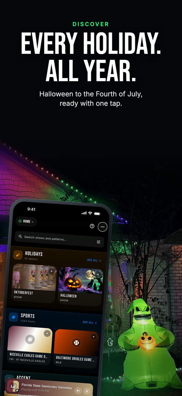Every holiday. All year. Halloween to the Fourth of July, ready with one tap. The app on a phone in front of a Chameleon install lit for Halloween.