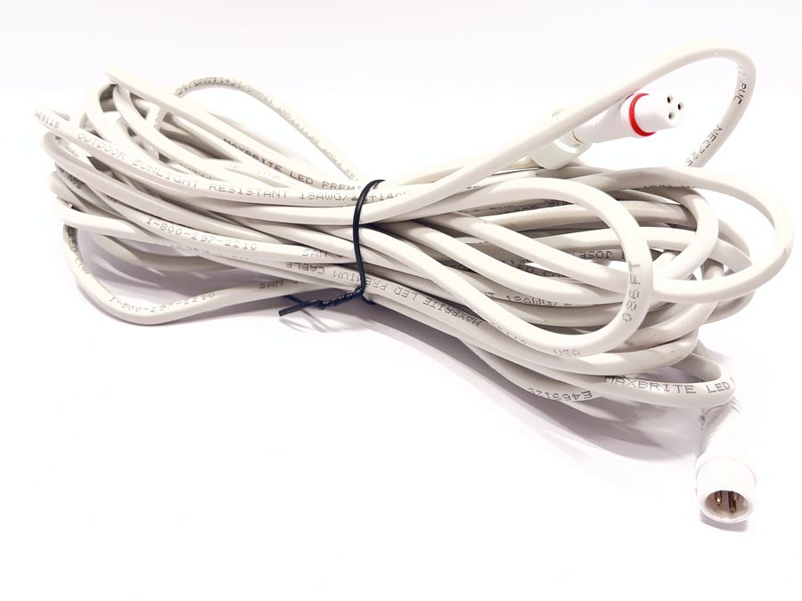 A coiled 25 foot white Class 2 wire with a waterproof connector on each end.